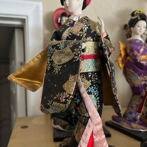 Elegant Japanese Doll in Black and Gold Kimono